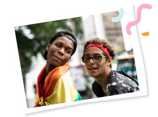 Young people at a Pride event with a flag