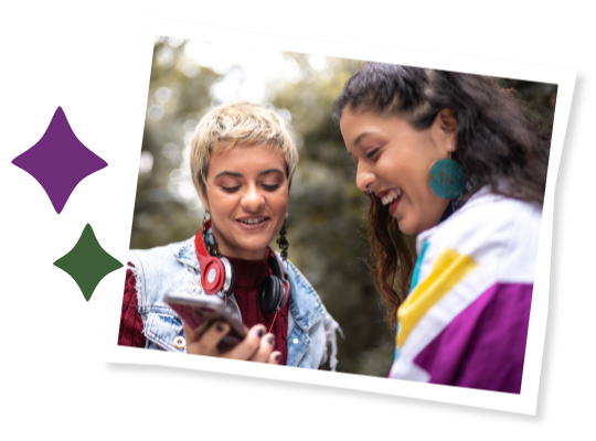Two young people looking at a phone